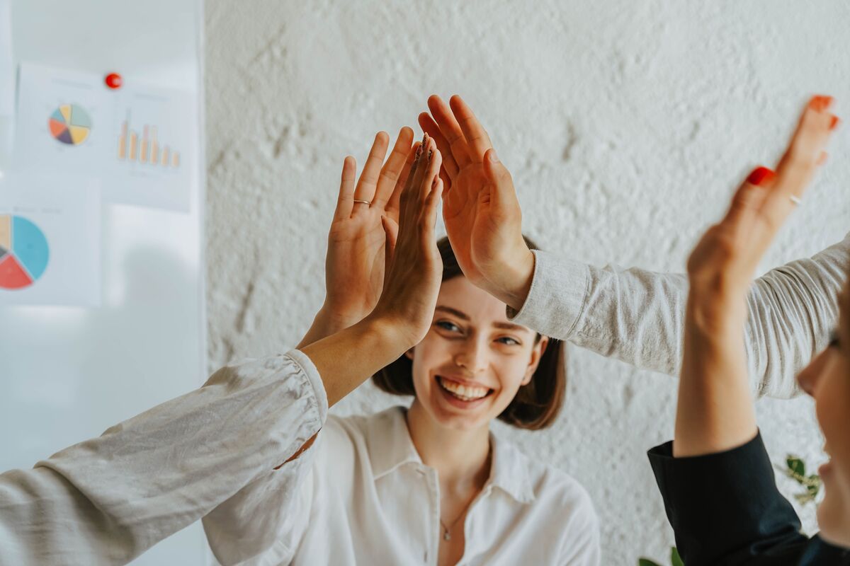 high fives in an office, CV key achievements