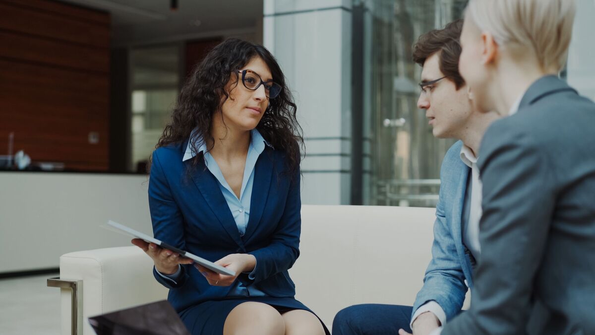 three colleagues talking, middle management