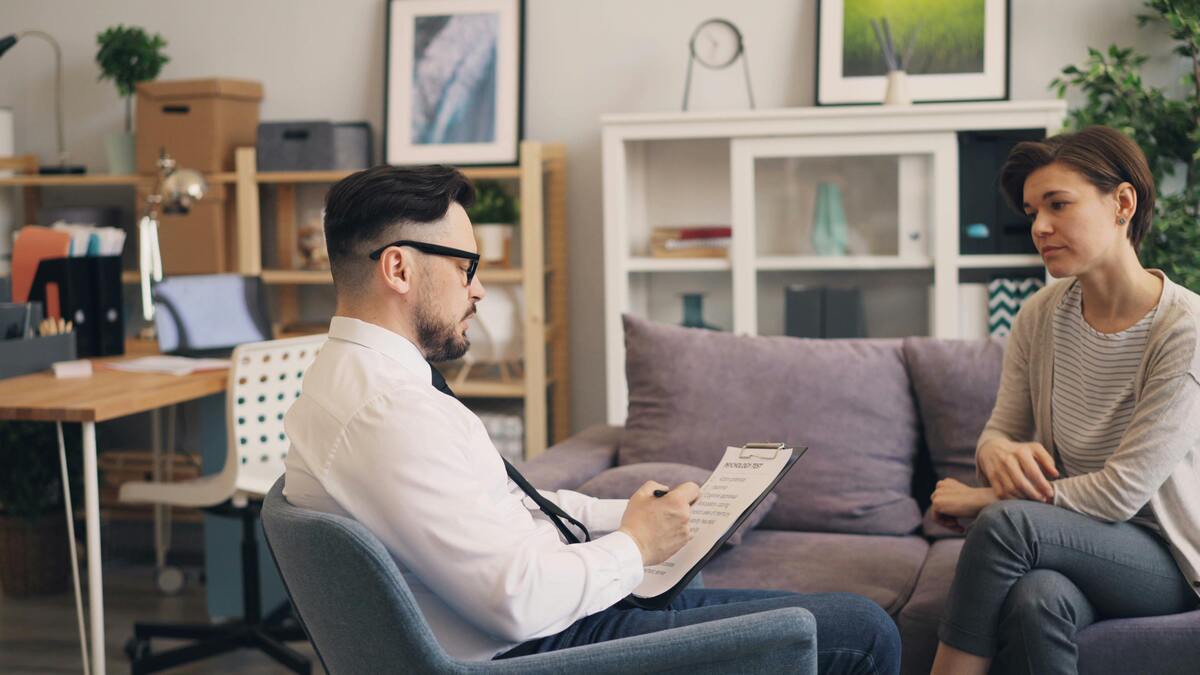 two people seated, values based recruitment